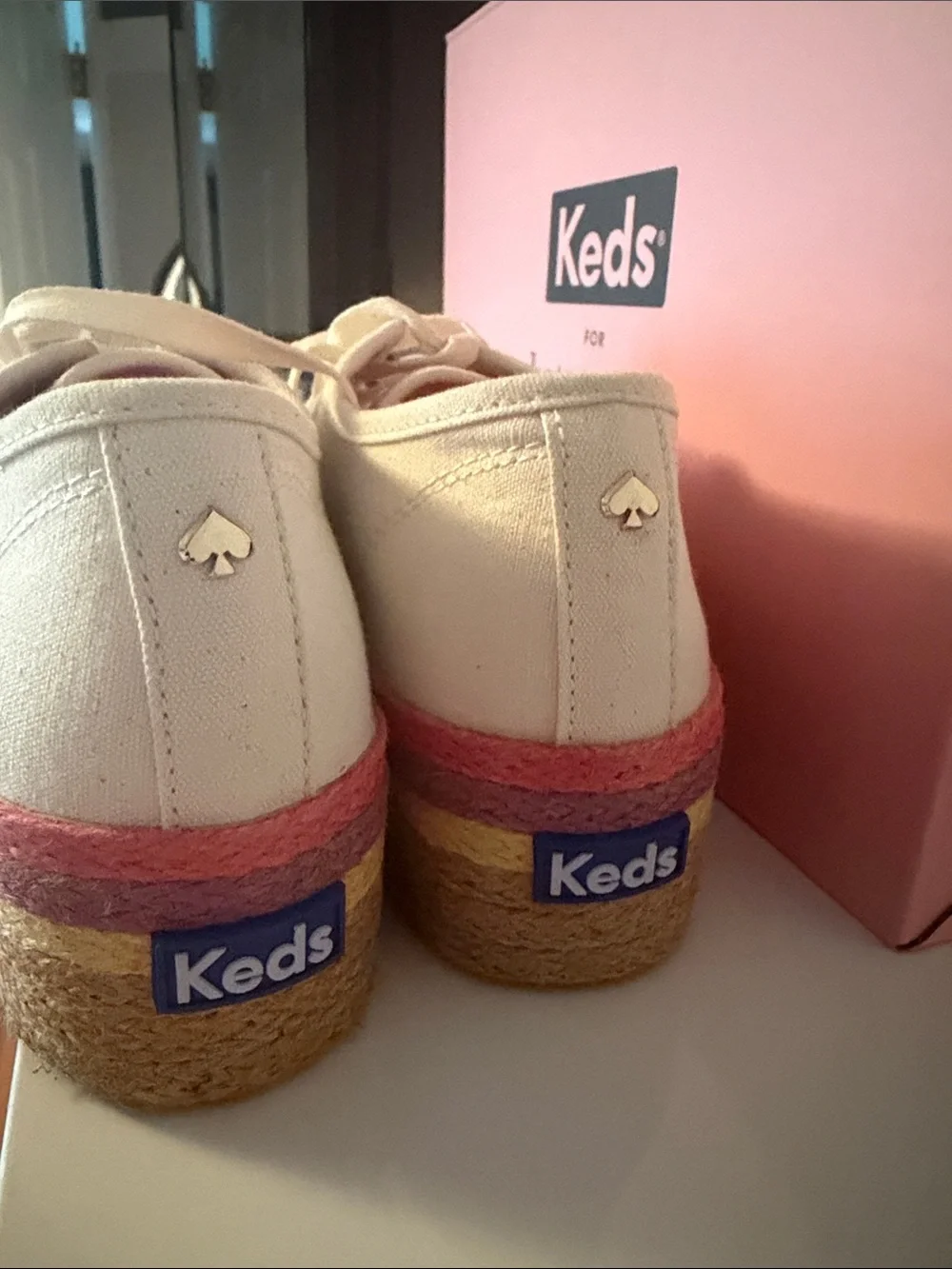 kate spade cream canvas platform sneakers with pink and gold accents